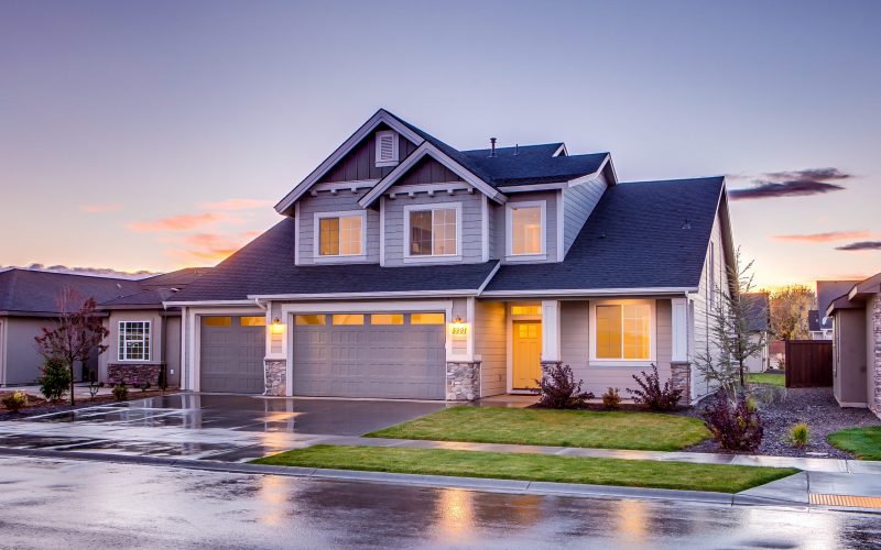 blue-and-gray-concrete-house-with-attic-during-twilight-186077